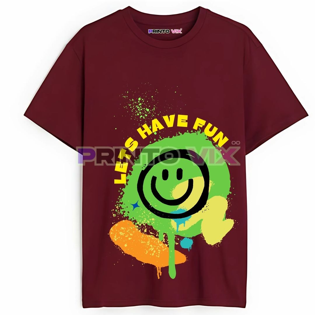 12 - PrintoVix A maroon t-shirt featuring a large, colorful splatter design with a green smiley face, yellow and orange paint accents, and the words LETS HAVE FUN in bold yellow text above the graphic, www.Printovix.com