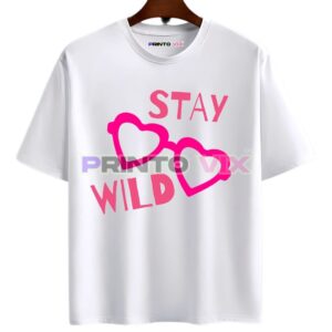White t-shirt with STAY WILD printed in bold pink letters and two overlapping heart outlines in pink at the center, www.Printovix.com