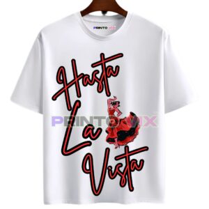 22 - PrintoVix White T-shirt hanging on a hanger with bold red and black text reading Hasta La Vista and an illustration of a woman in a red flamenco dress dancing, www.Printovix.com